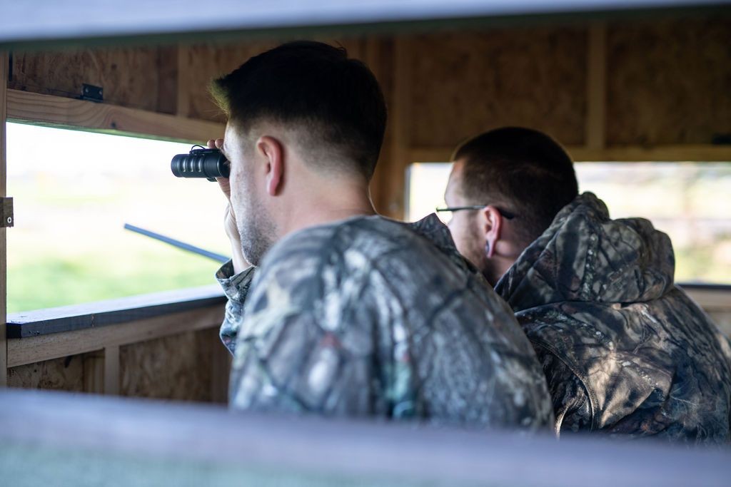Two hunters inside of EZ Hunting Blind